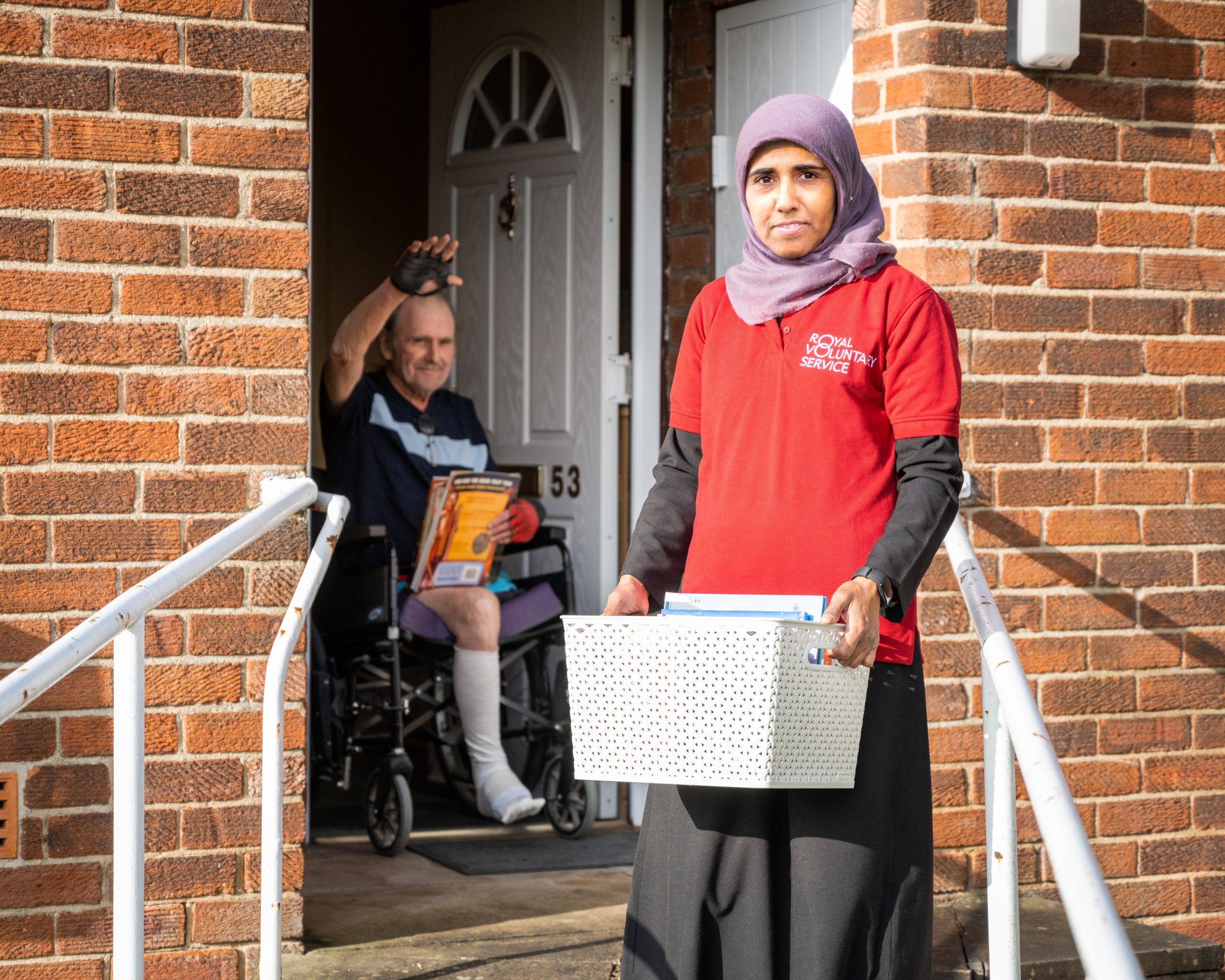 RVS volunteer helping people at their door