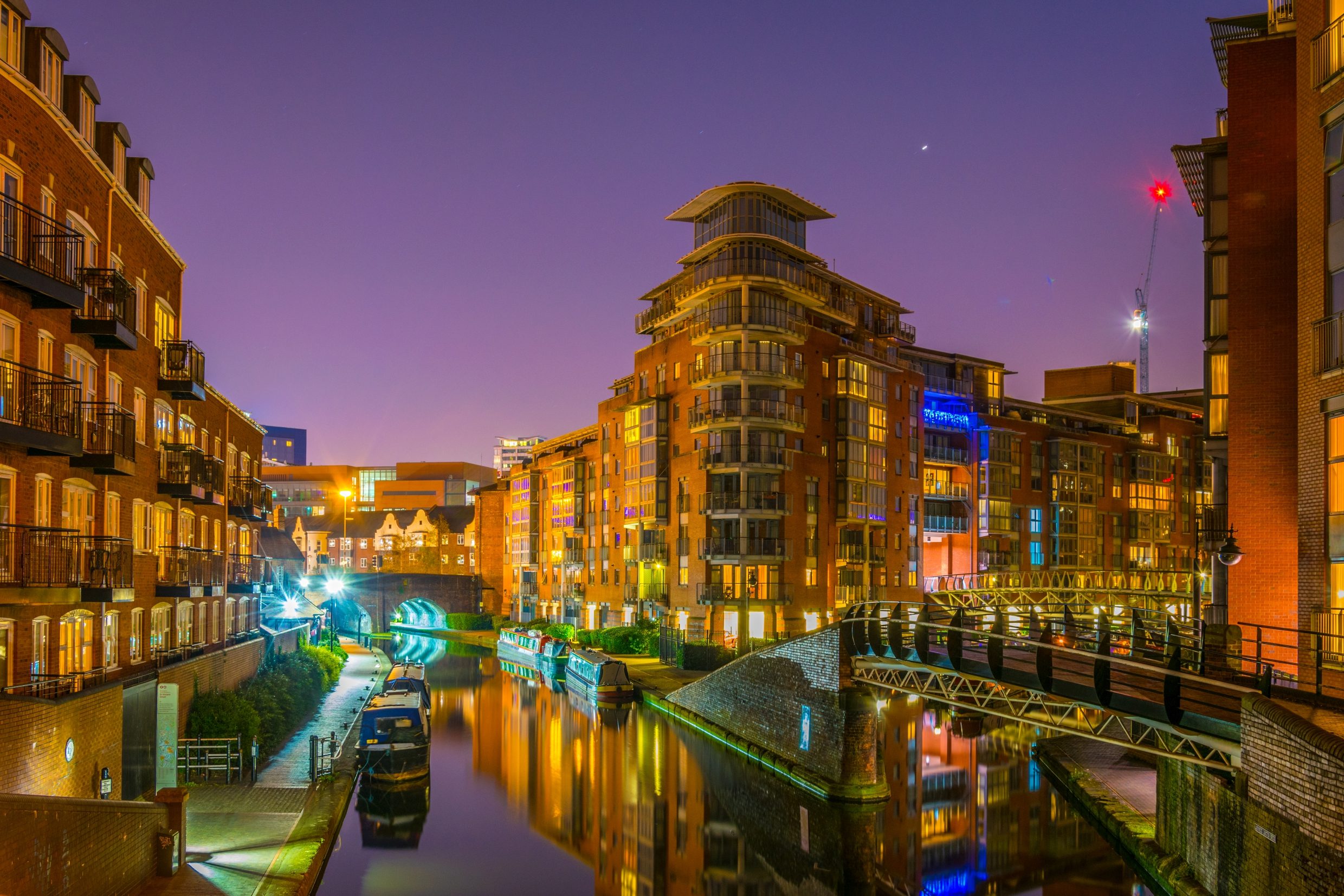 Night view of a canal and buildings in a tranquil city centre