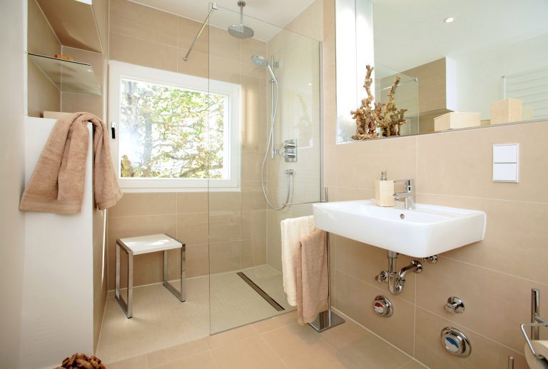 A bright, accessible bathroom renovation showing a larger shower