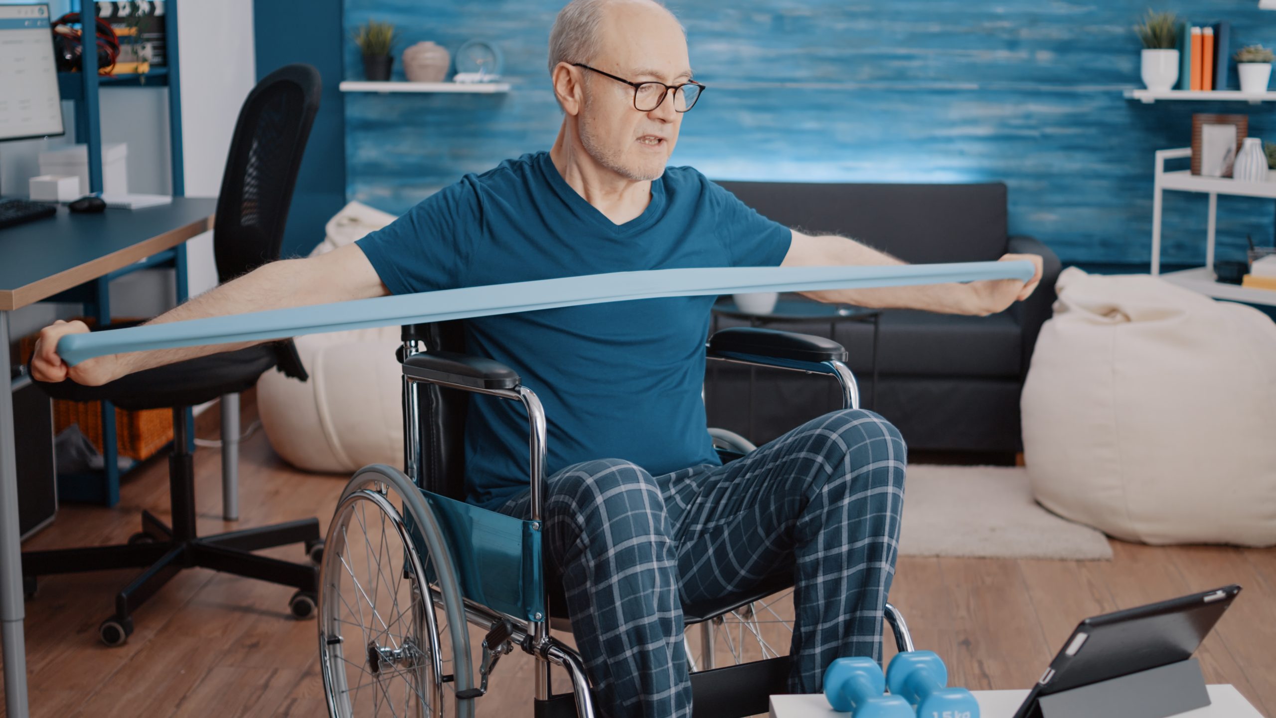 Man in wheelchair exercising with resistance band