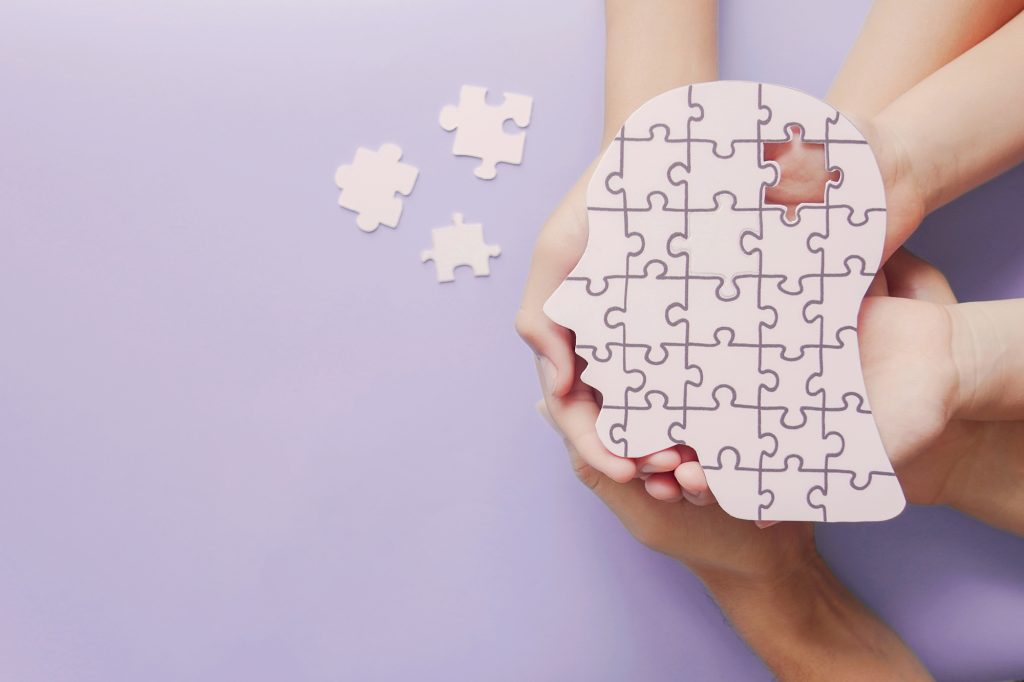 Dementia concept image showing a jigsaw puzzle missing a piece