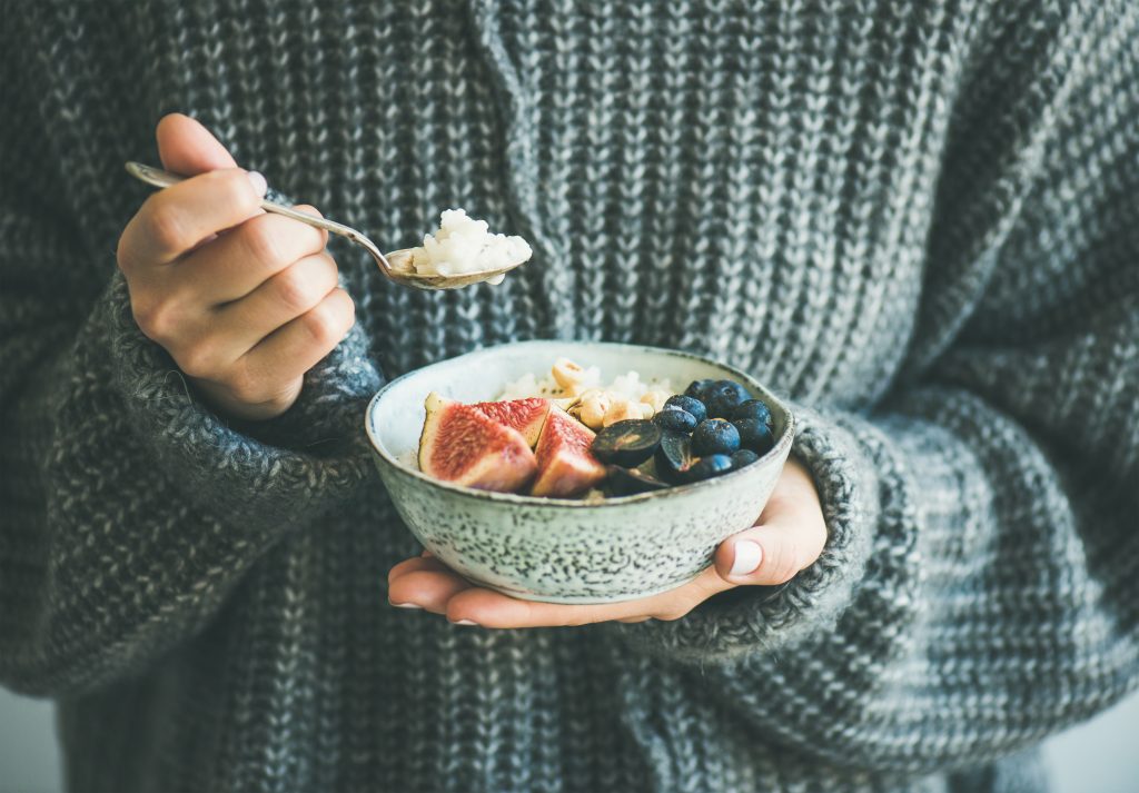 A woman eating a healthy breakfast