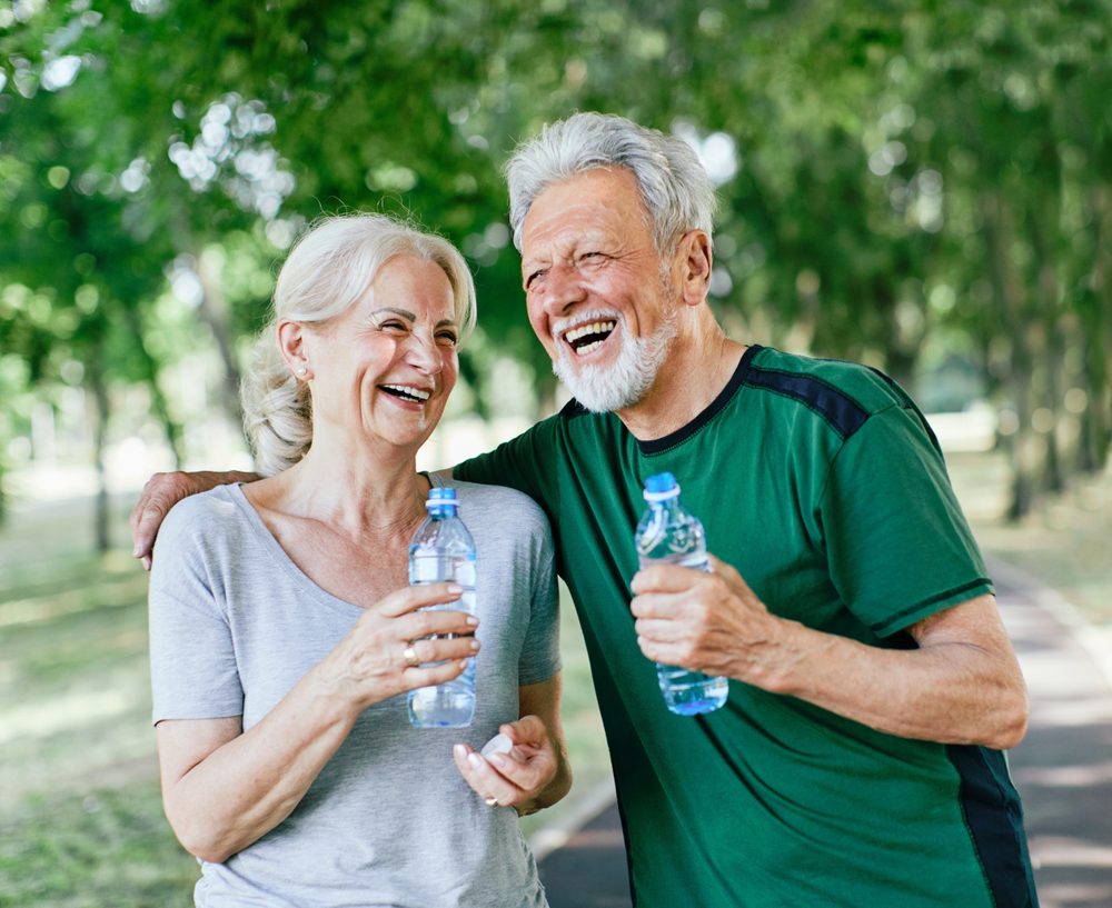 Elderly couple drinking water